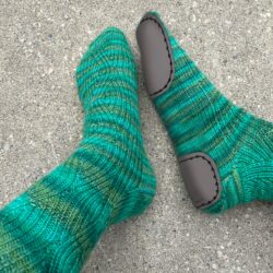 2-part-slipper soles stitched on handmade sock, contains a heel and toe piece.