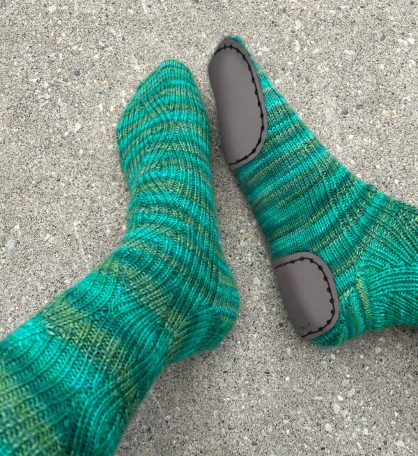 2-part-slipper soles stitched on handmade sock, contains a heel and toe piece.