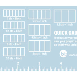 Clear 6 x 3 inch knit gauge tool with engraved stitch grid and ruler for measuring knitting gauge.